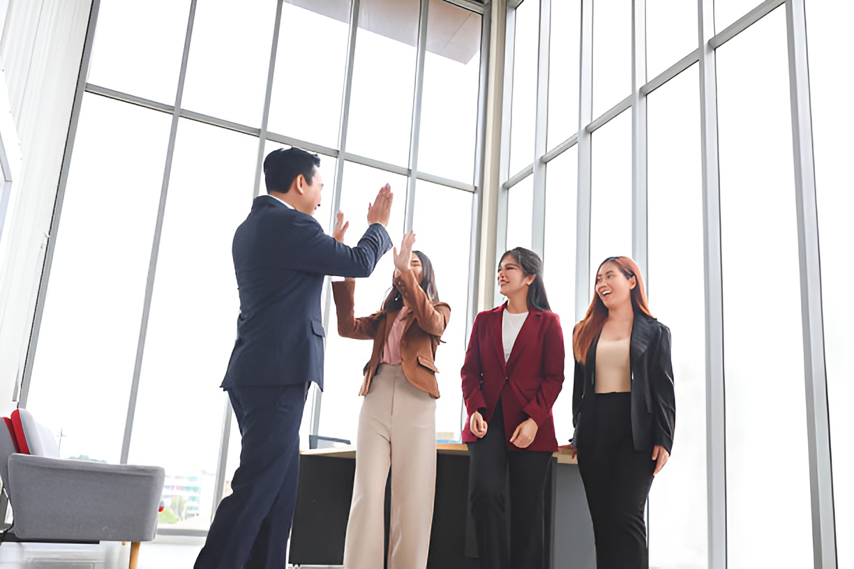 employees giving each other a high five