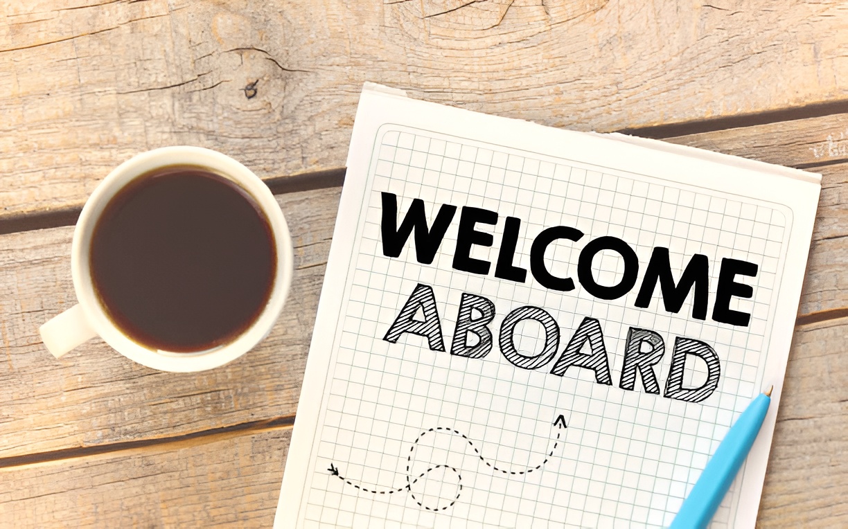 notepad with 'welcome aboard' text